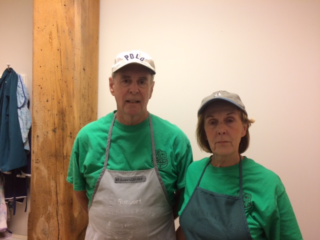 two volunteers ready to serve