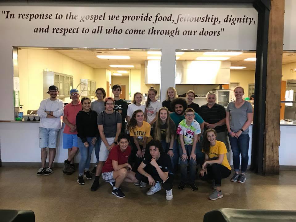 volunteers ready to serve in the dining room