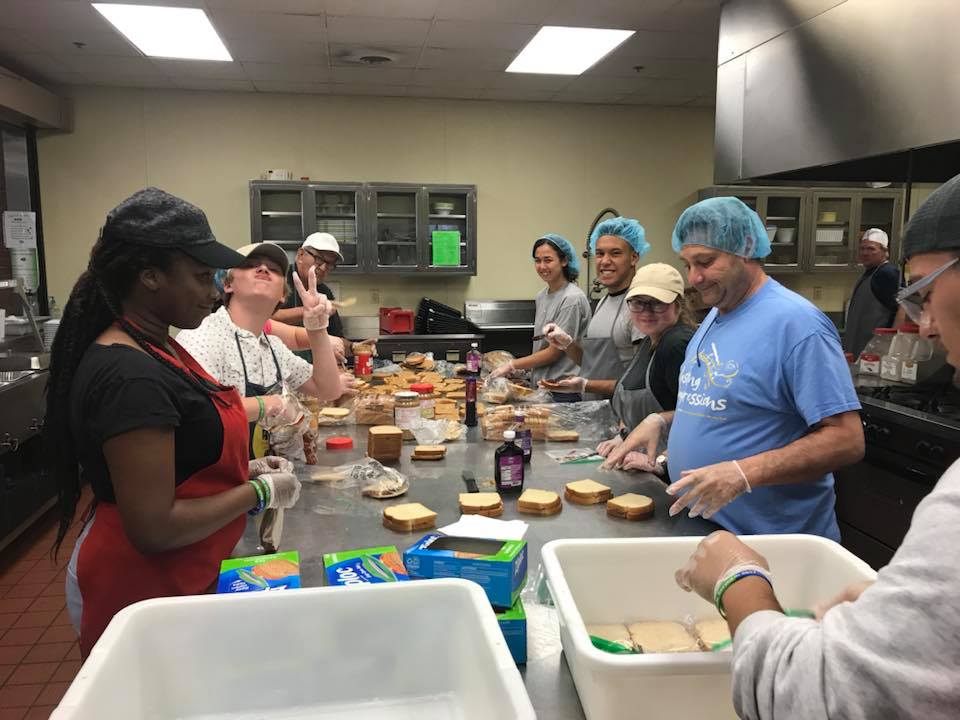 volunteers in the kitchen making sandwiches