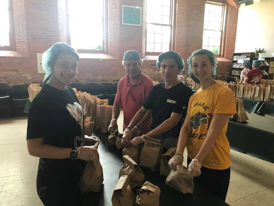 volunteers bagging lunches